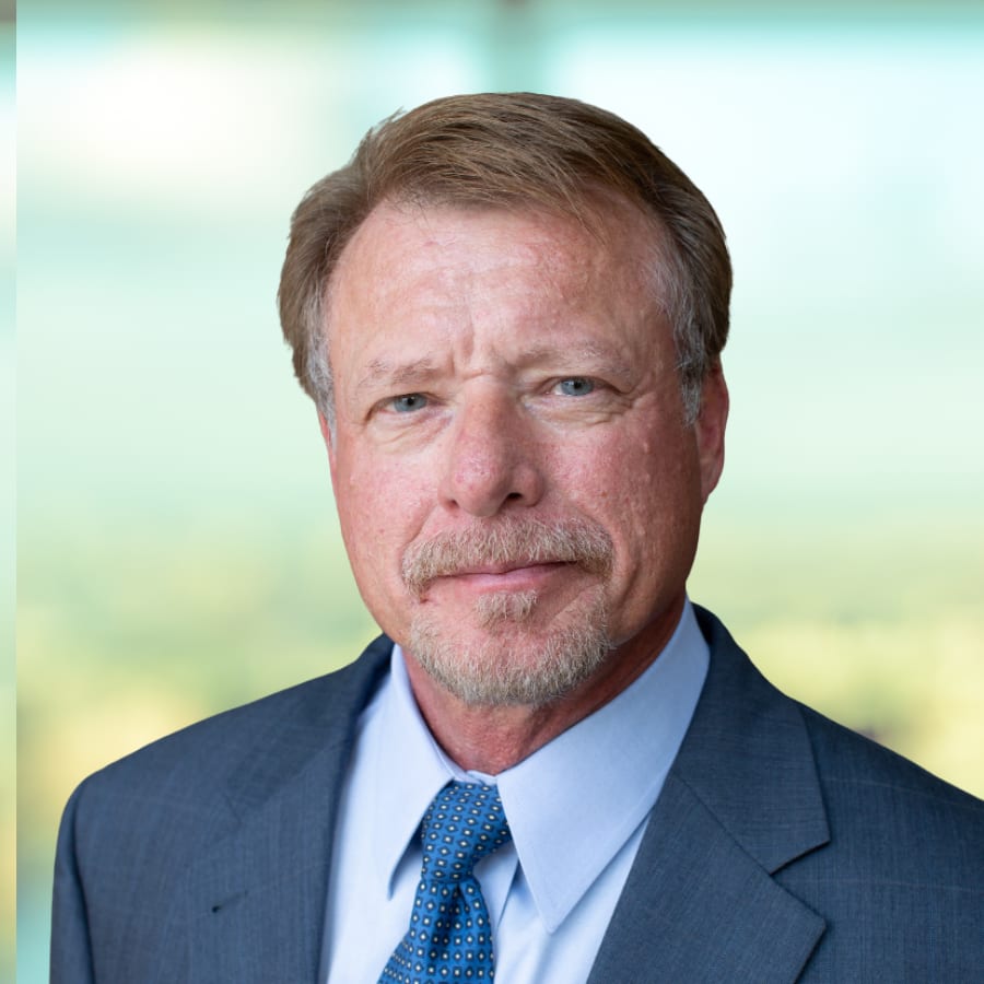 Executive Jay Wagoner, man with short brown hair and goatee wearing a blue suit